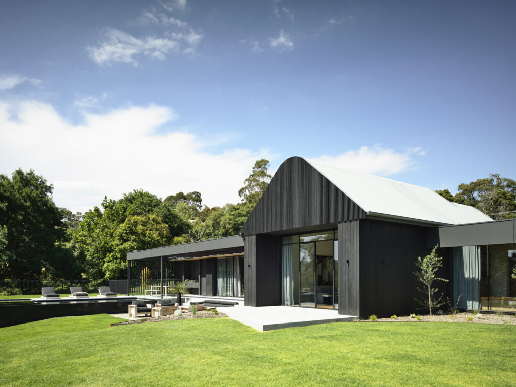 Black timber façade and beams installed on Suburban residential building 